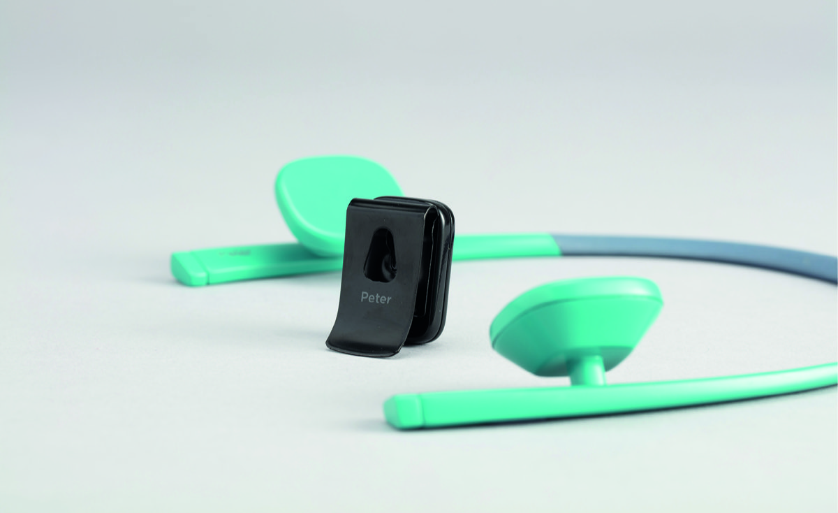 The Peter Neurotech device — a discreet green-and-grey mobility aid